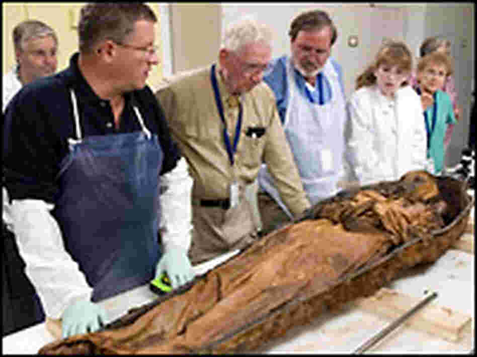 Examining the body. Credit: Ken Rahaim. Examining the body. Credit: Ken Rahaim.