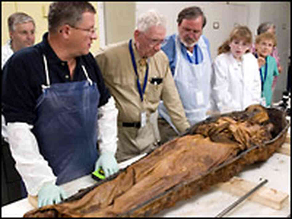 Examining the body. Credit: Ken Rahaim. Examining the body. Credit: Ken Rahaim.