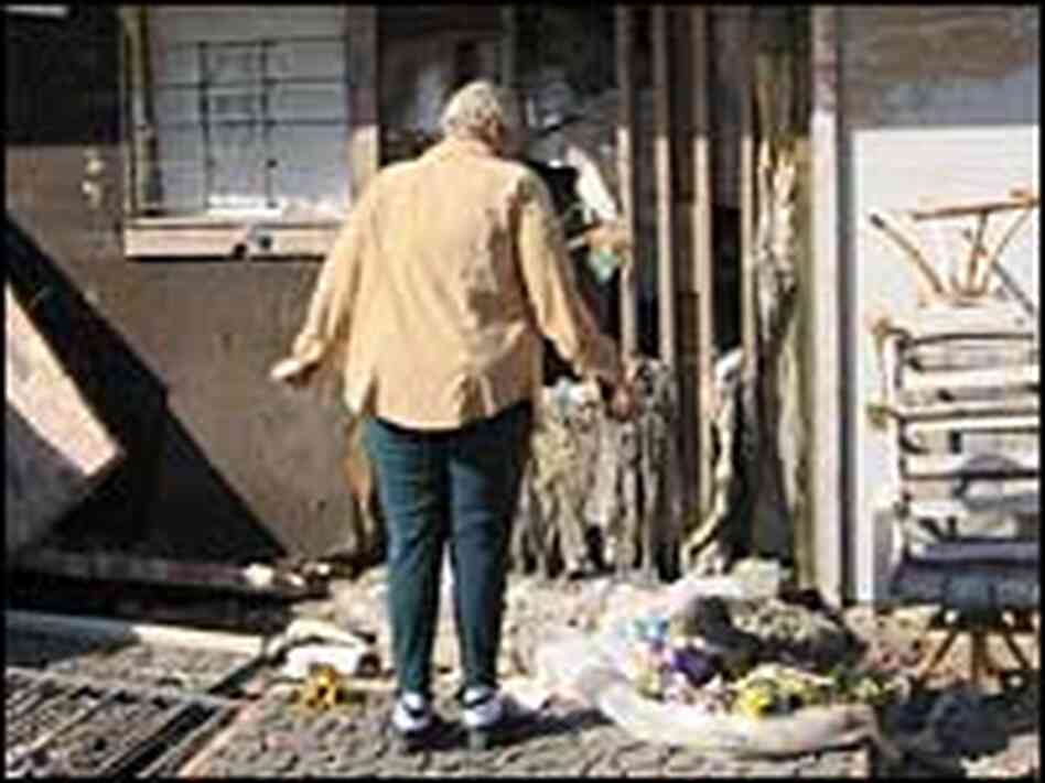 Walker at door of house