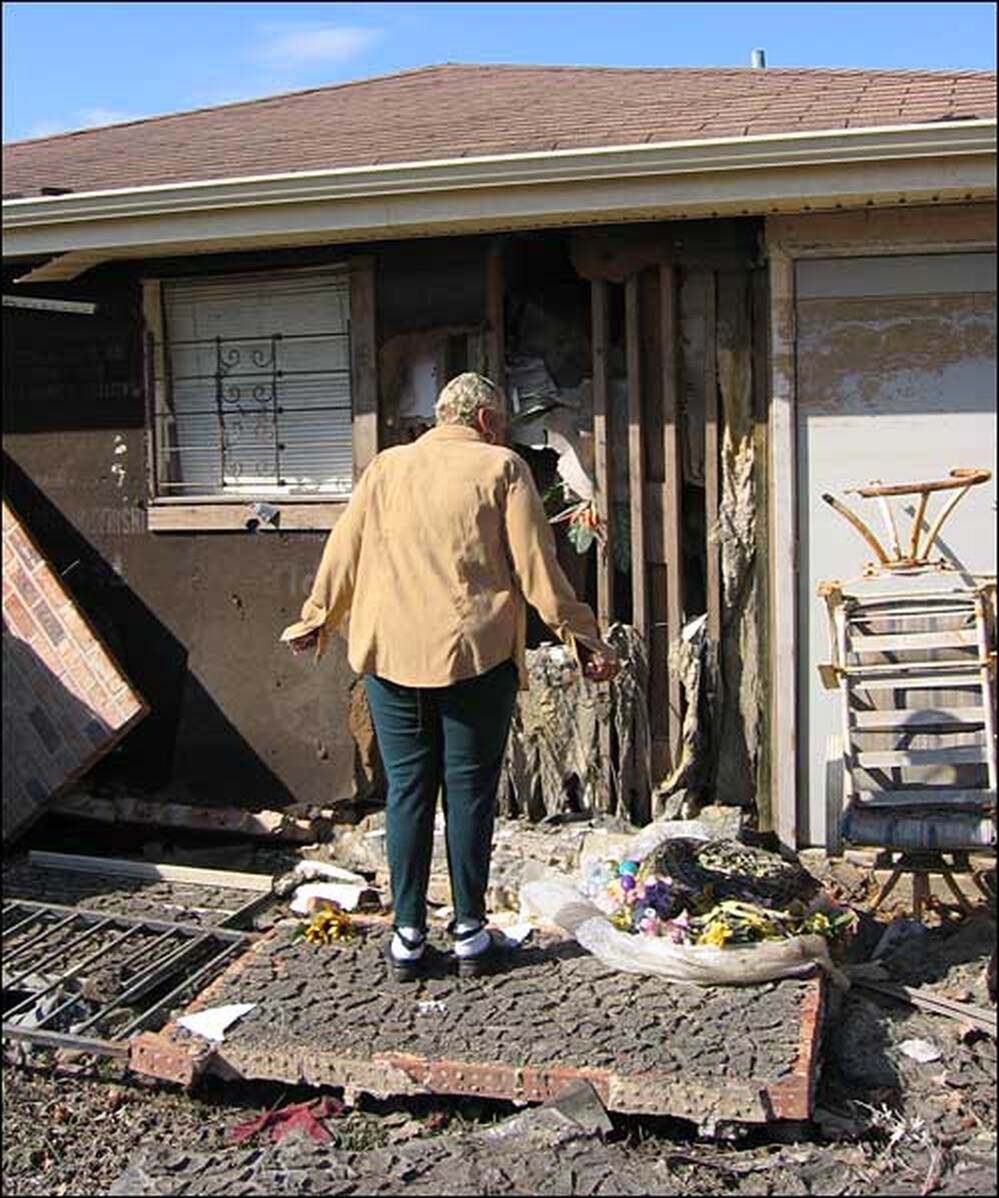 Walker at door of house