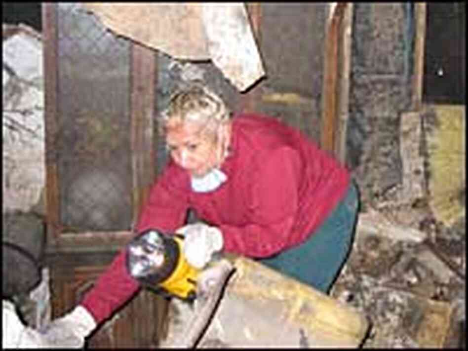Walker inspects damage