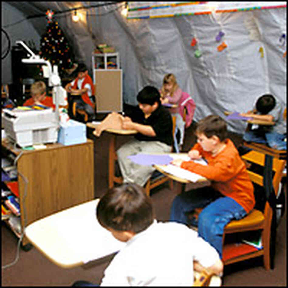 Kids in a tent classroom. Credit: Steve Drummond, NPR. Kids in a tent classroom. Credit: Steve Drummond, NPR.