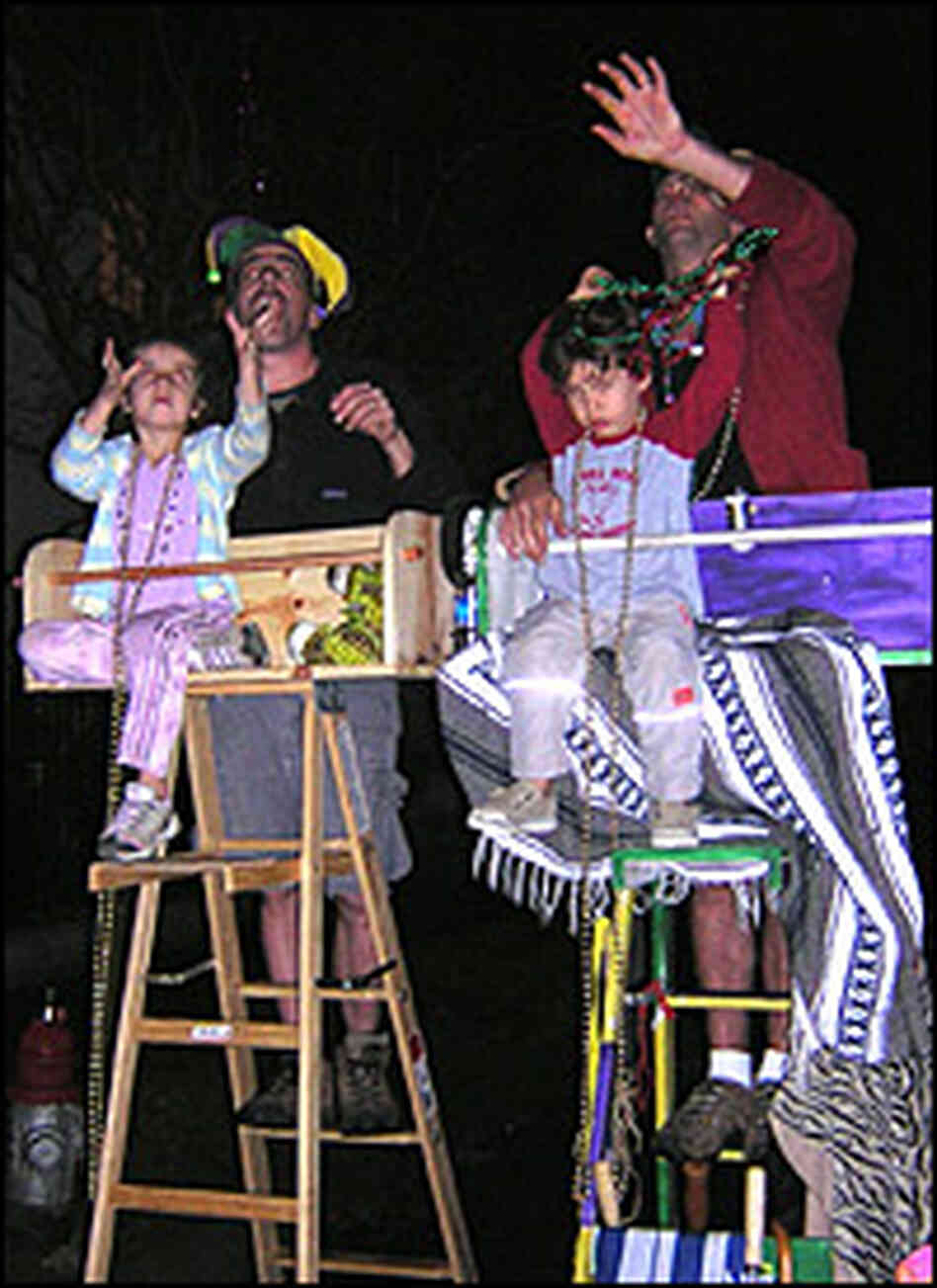 Kids -- and adults -- enjoy a little extra lift during a parade from a Mardi Gras ladder. Kids -- and adults -- enjoy a little extra lift during a parade from a Mardi Gras ladder.