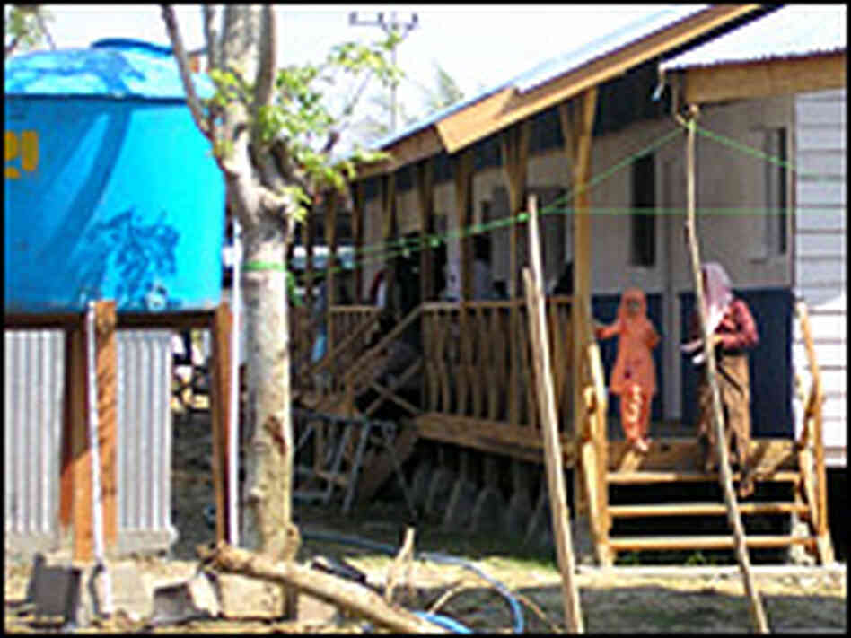 New infrastructure in Aceh includes a water system and temporary housing. Michael Sullivan, NPR New infrastructure in Aceh includes a water system and temporary housing. Michael Sullivan, NPR