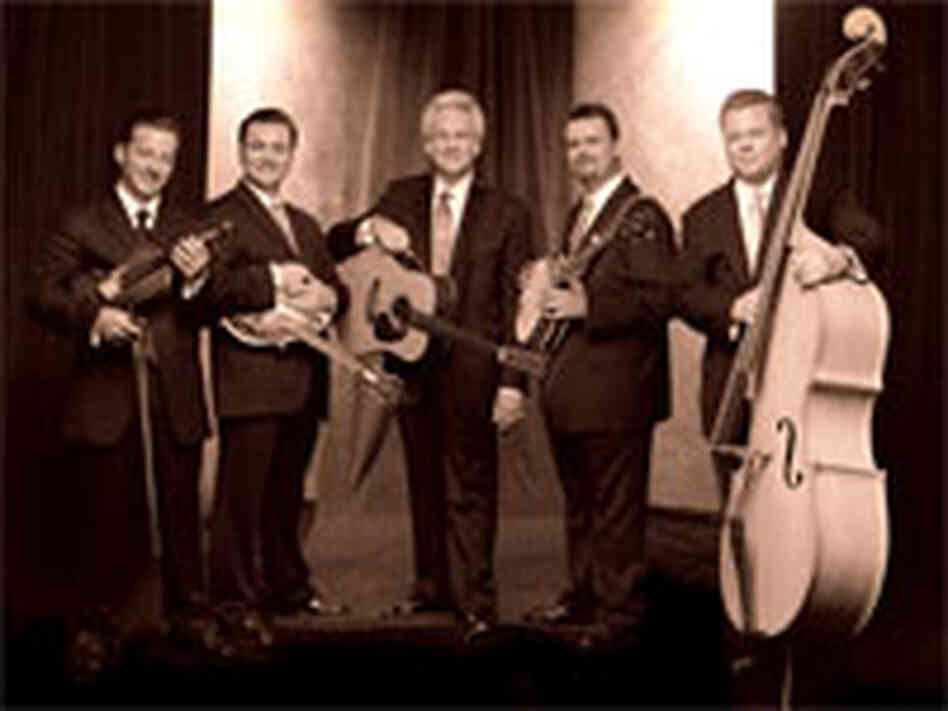 Del McCoury (center), with sons Ronnie and Rob and other band members.
