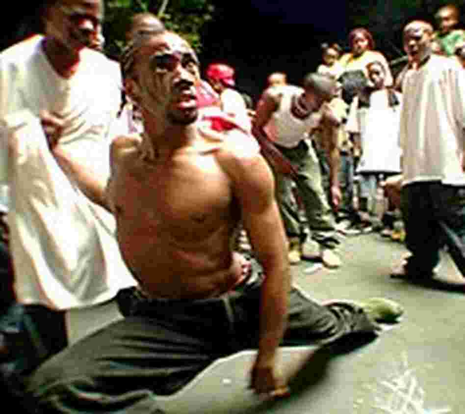 Dancer in a krumping street challenge, captured in the film 'Rize' Dancer in a krumping street challenge, captured in the film 'Rize'