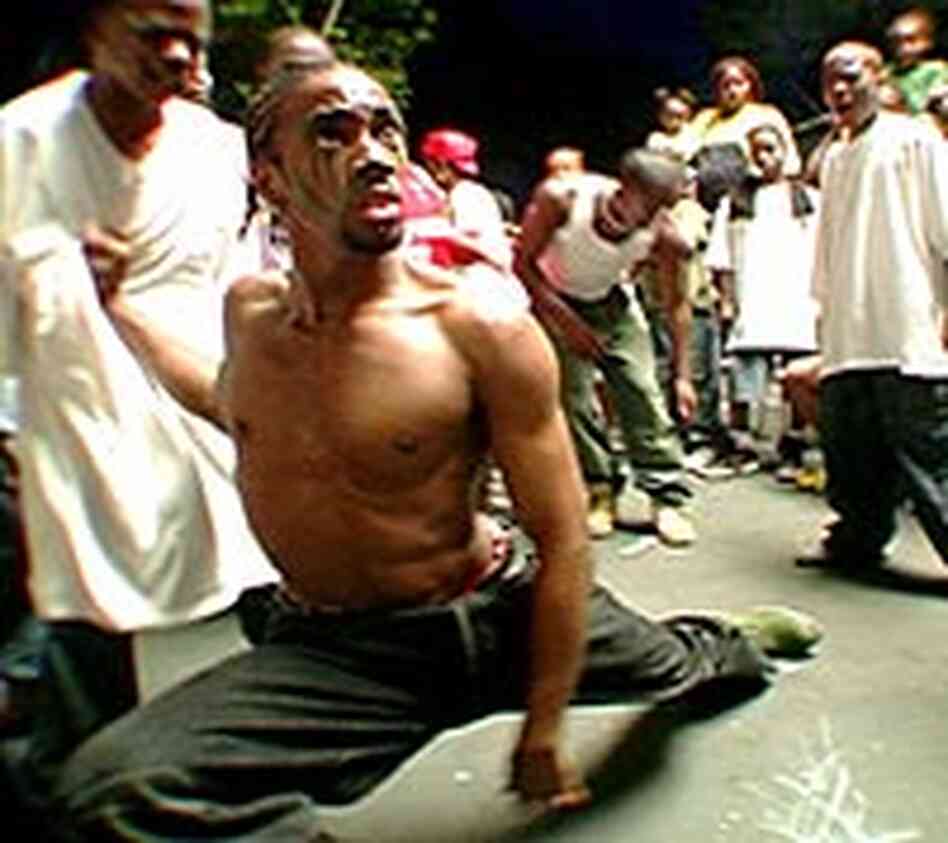 Dancer in a krumping street challenge, captured in the film 'Rize' Dancer in a krumping street challenge, captured in the film 'Rize'