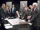 Bush cabinet members discuss a map of Iraq in a scene from 'Stuff Happens' Bush cabinet members discuss a map of Iraq in a scene from 'Stuff Happens'