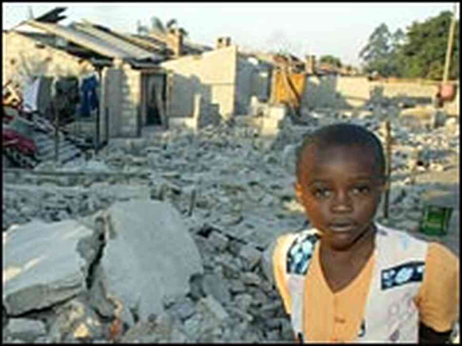 Girl stands amid rubble of destroyed homes. Girl stands amid rubble of destroyed homes.