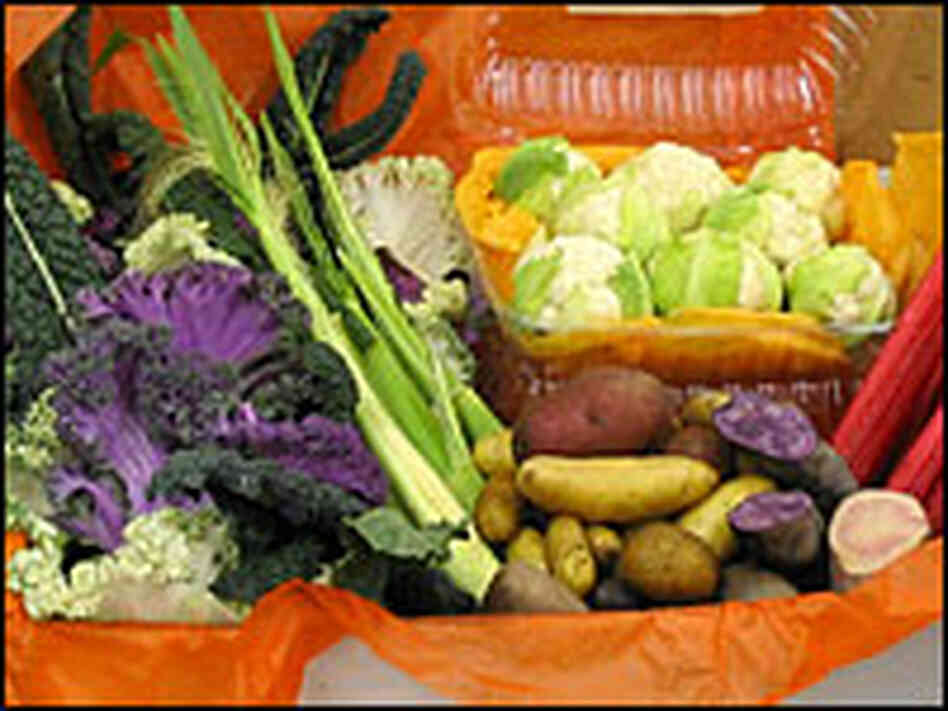 A box of assorted vegetables -- from fingerling potatoes to artisan cauliflower. A box of assorted vegetables -- from fingerling potatoes to artisan cauliflower.
