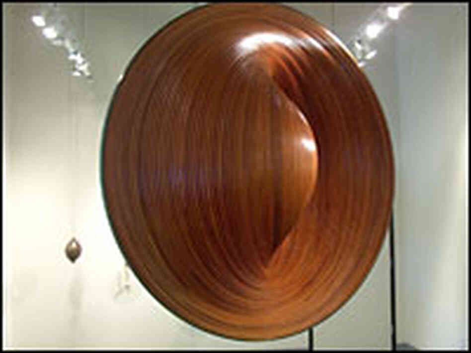 'Encircled Void,' a spiral sculpture made of teak by Ned Kahn 'Encircled Void,' a spiral sculpture made of teak by Ned Kahn