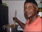 Robert 'King' Wilkerson stirs a batch of his famed pralines in a friend's Bay Area kitchen. Robert 'King' Wilkerson stirs a batch of his famed pralines in a friend's Bay Area kitchen.