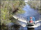 A flat-bottomed airboat is the only way to travel through the Louisiana marshlands A flat-bottomed airboat is the only way to travel through the Louisiana marshlands