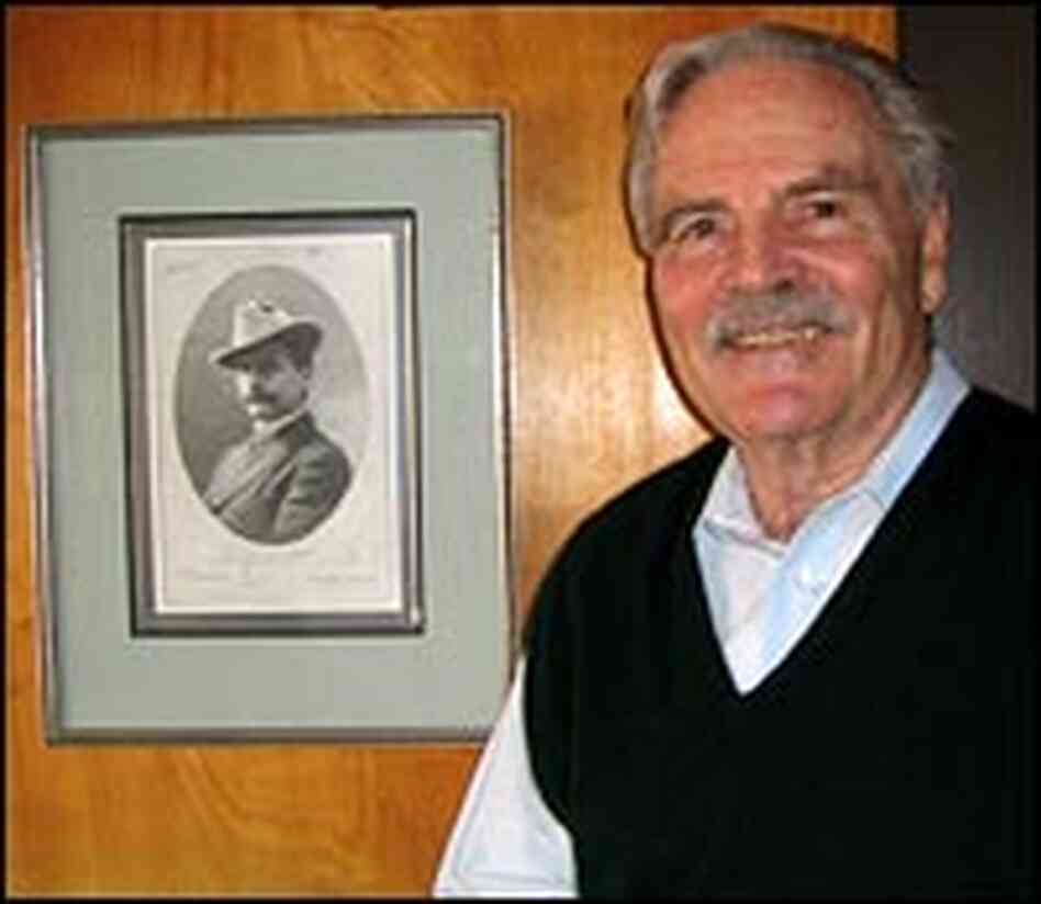 Richard Monaco stands near a photo of his grandfather, J.B. Monaco. 