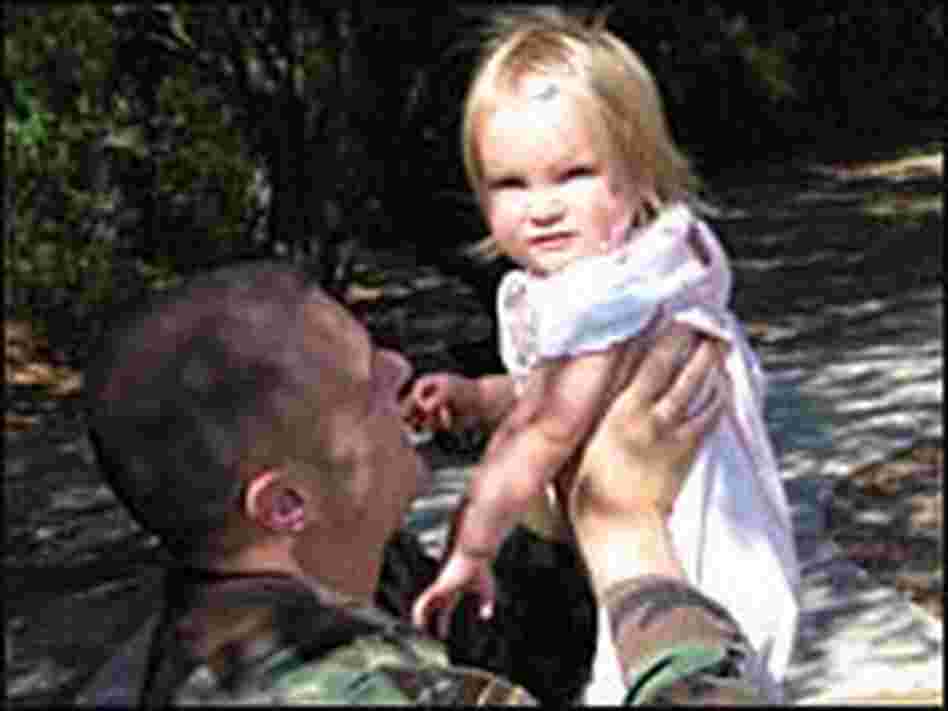 Townsend holds his baby daughter, Viola. Townsend holds his baby daughter, Viola.