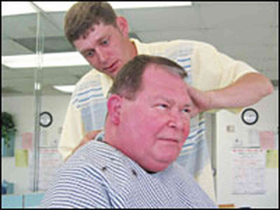 Jason Long gives one of his regular customers, Dr. Arthur Klein III, a standard-issue military hair Jason Long gives one of his regular customers, Dr. Arthur Klein III, a standard-issue military hair