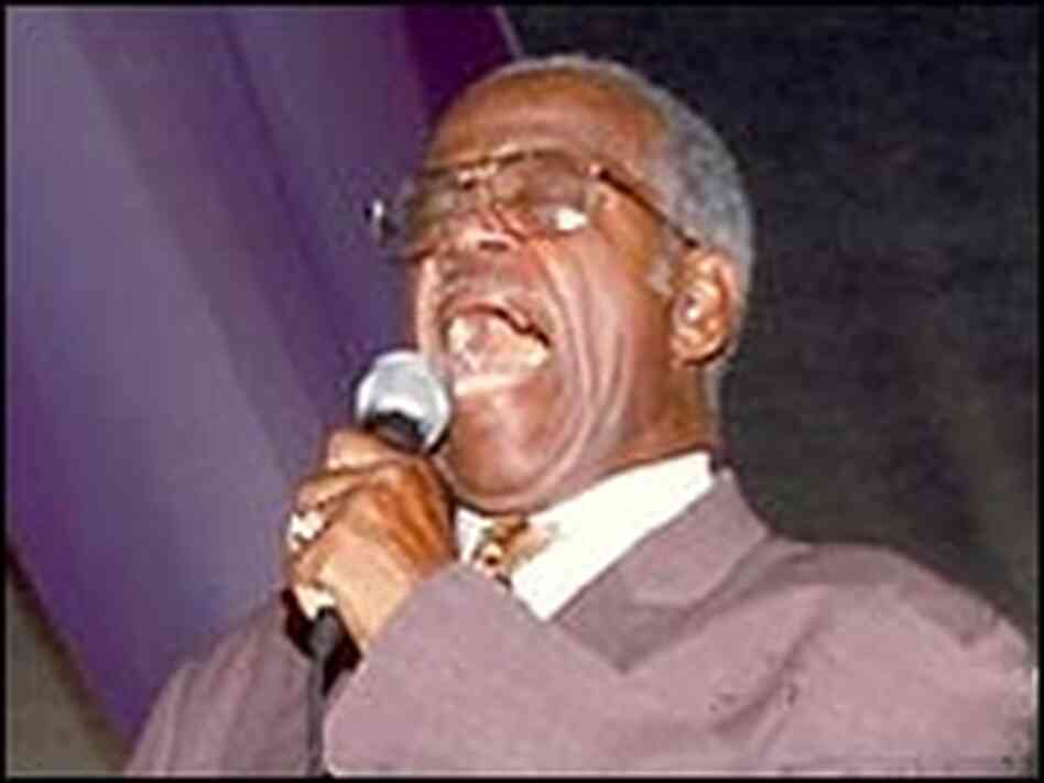 Sherman Washington sings in the Gospel Tent. Sherman Washington sings in the Gospel Tent.