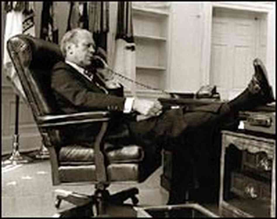 President Ford talks on the phone in the Oval Office in 1974. President Ford talks on the phone in the Oval Office in 1974.