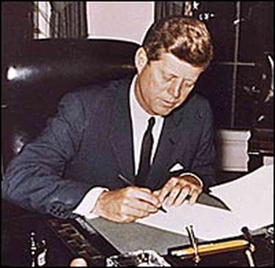 President Kennedy signs a proclamation of a naval blockade against Cuba. President Kennedy signs a proclamation of a naval blockade against Cuba.