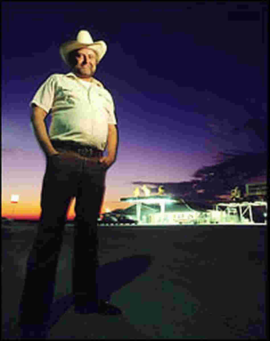 Carl Cornelius in front of his truck stop.