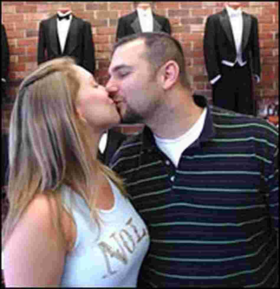 Phil Farrow and his fiancee Sarah Shipman kiss.