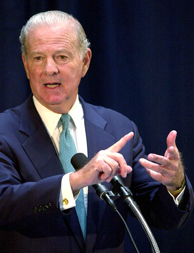 James Baker speaks with reporters at a November 2000 press conference in Tallahassee, Fla.