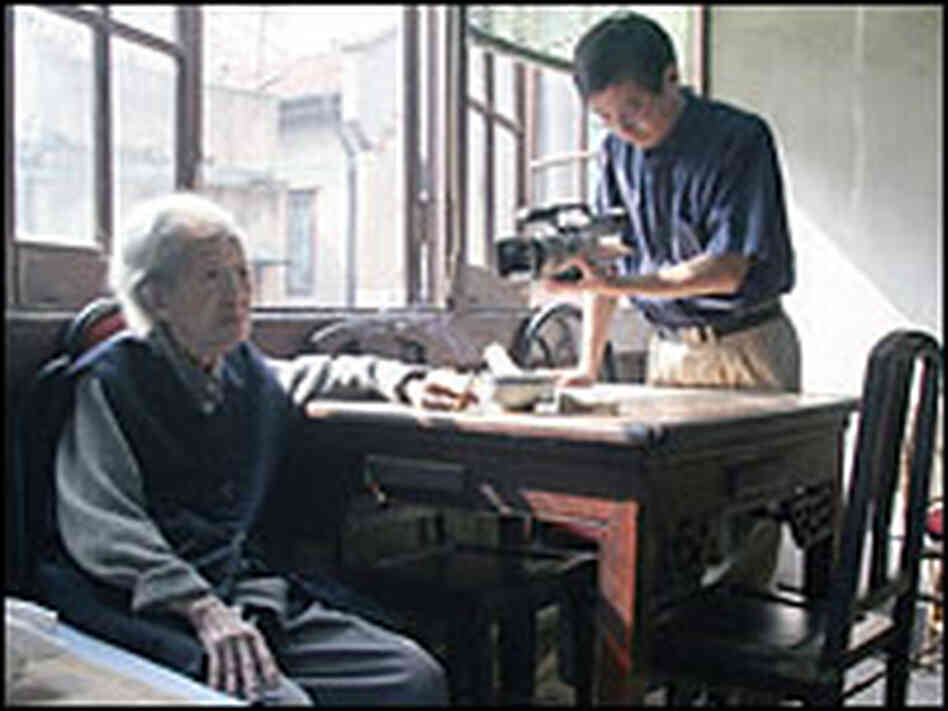 Shu Haolun films his grandmother in his family's old house.