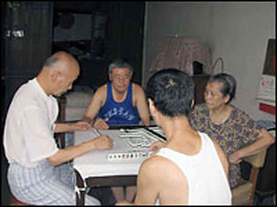 Neighbors play mahjong in Shu Haolun's grandmother's room. He no longer lives in Dazhongli.