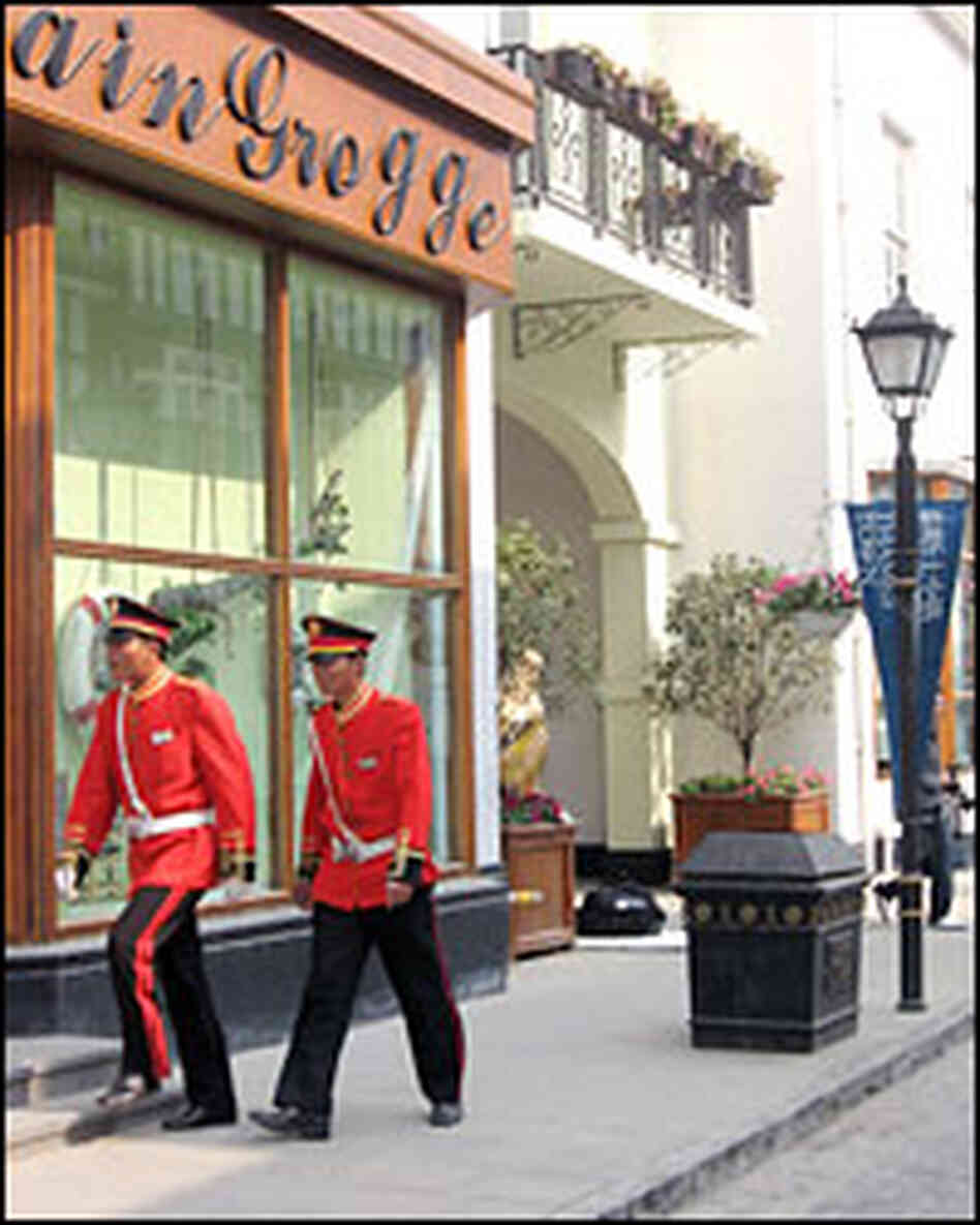 Even Thames Town's security guards have special touches to their uniforms that seem designed to evok