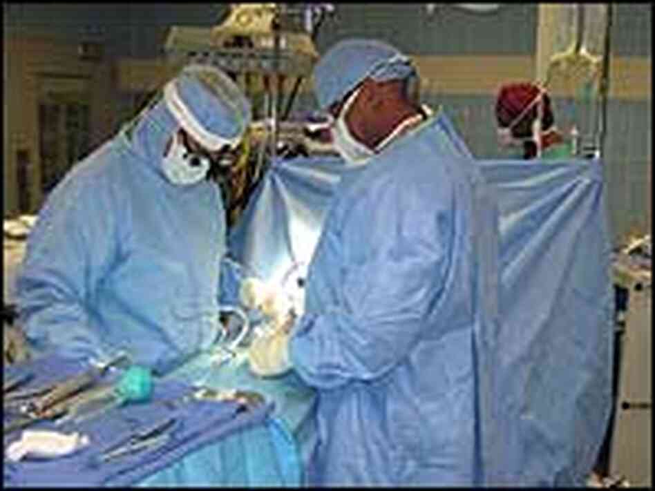 Orthopedic surgeon John Starr, left, performing a back surgery at Washington Hospital Center in Wash Orthopedic surgeon John Starr, left, performing a back surgery at Washington Hospital Center in Wash