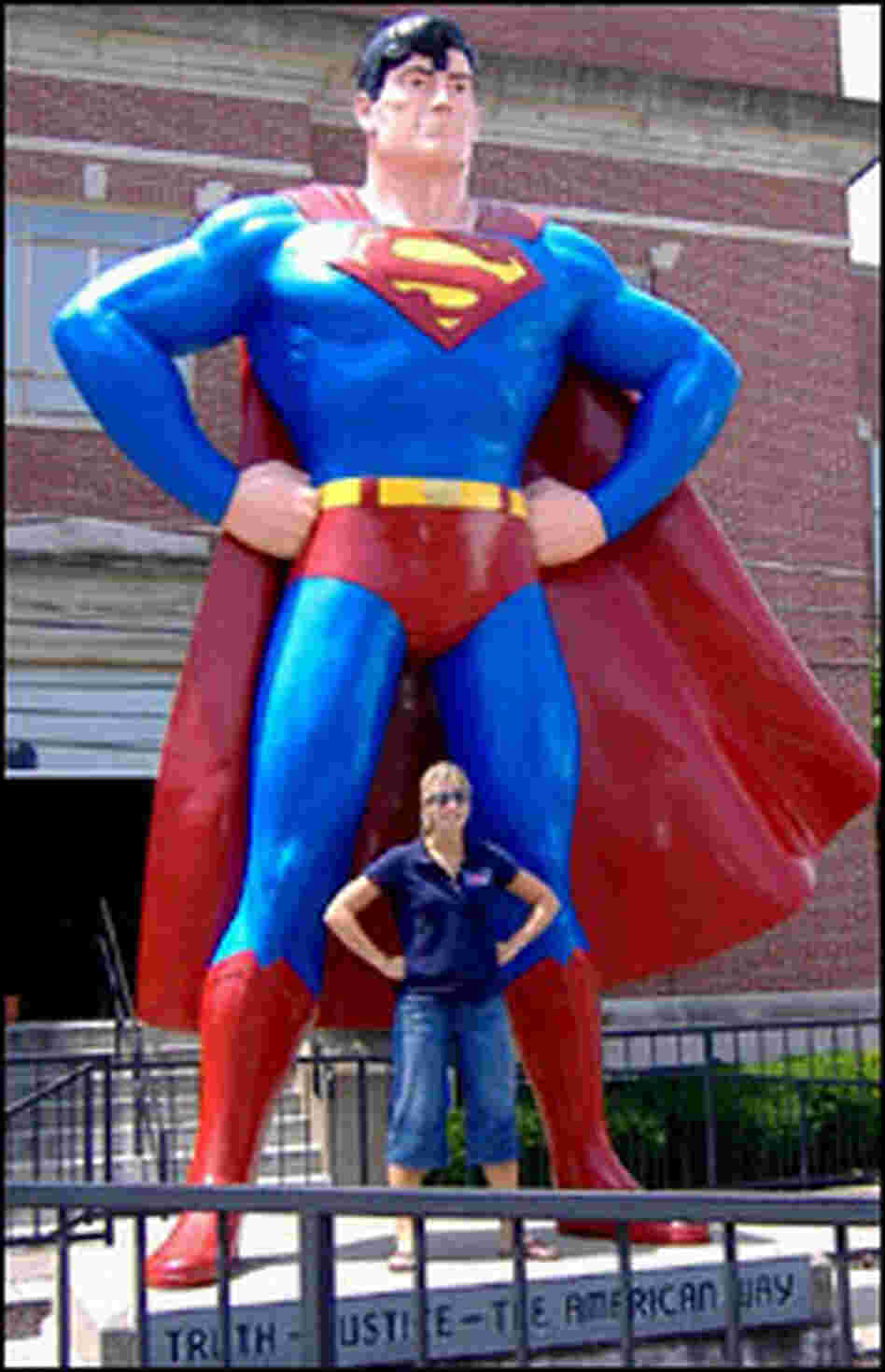 Joanna Jackson, of Chicago, stops to pose for a photo with the Superman statue in Metropolis