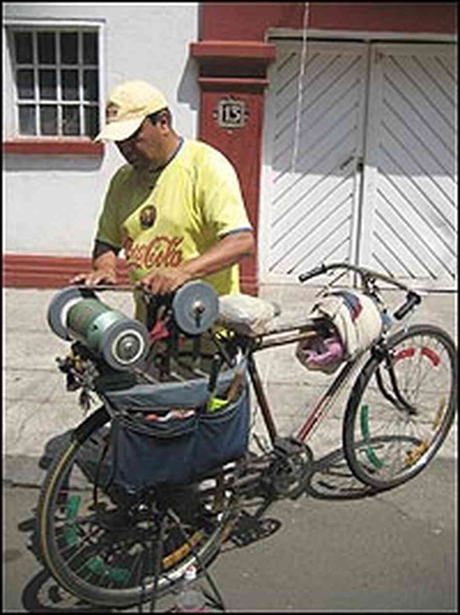 Porfirio Salinas has modified his bike to become a mobile knife sharpening shop. Porfirio Salinas has modified his bike to become a mobile knife sharpening shop.