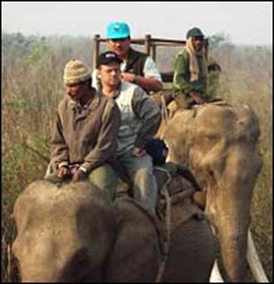 John Nielsen, in the dark cap, joins conservationists on a 2001 hunt to capture rhinos. John Nielsen, in the dark cap, joins conservationists on a 2001 hunt to capture rhinos.