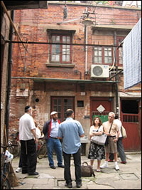 Dvir Bar-Gal (center, in blue shirt) leads a tour in Shanghai's Jewish ghetto.