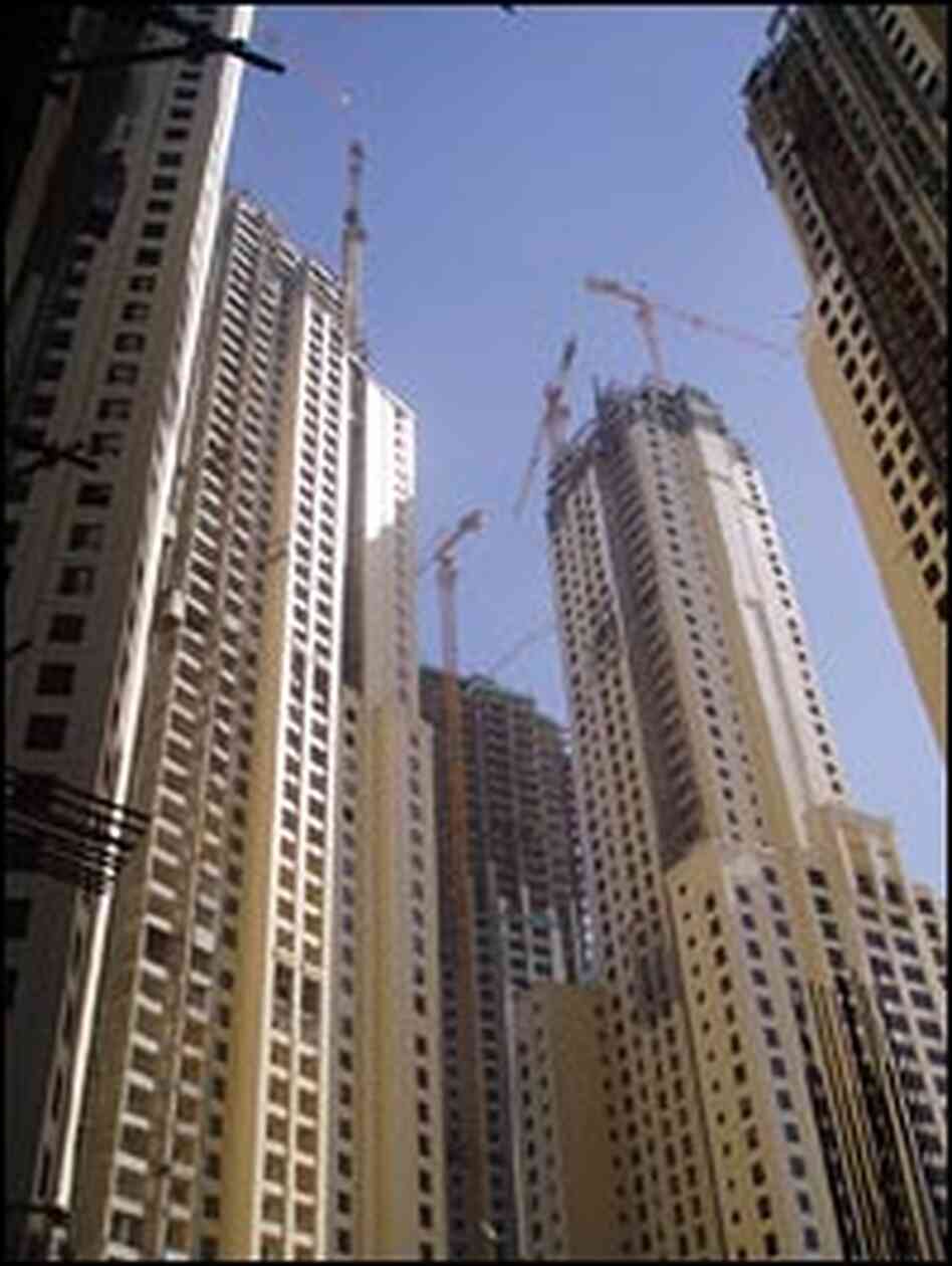 Clusters of new apartment and office blocks under construction.