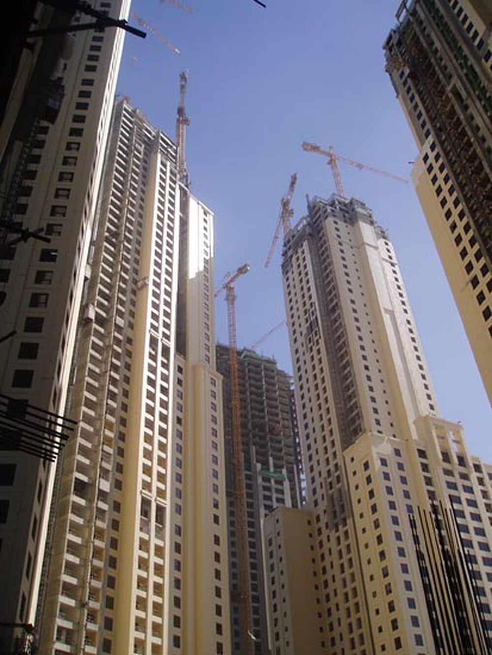 Clusters of new apartment and office blocks under construction.