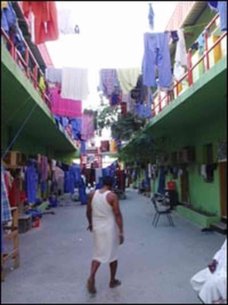 Blue uniforms hang out to dry at one of a labor camps at the edge of the city. 