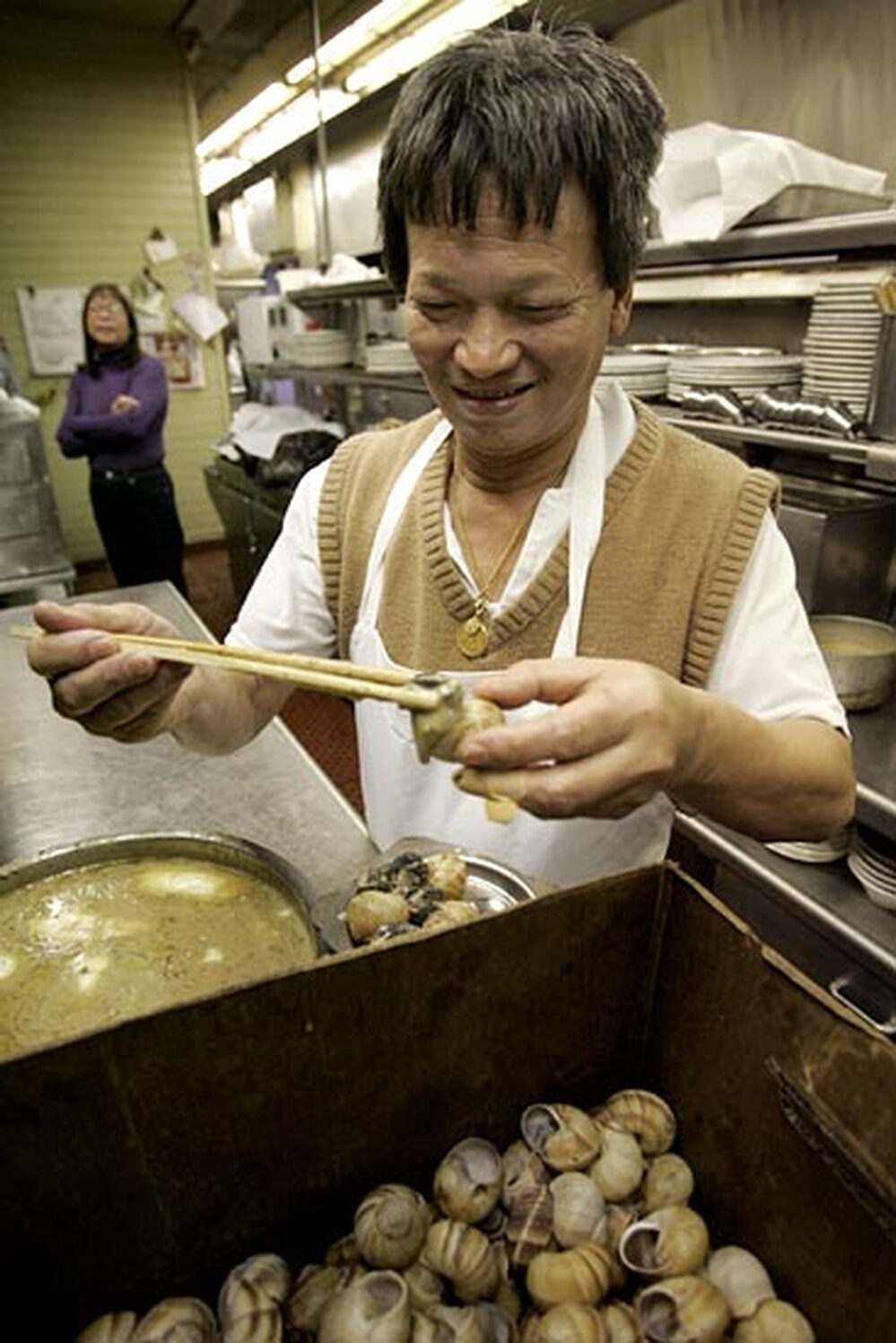Kenny Auyeong prepares the Imperial Dynasty's famous escargot. 