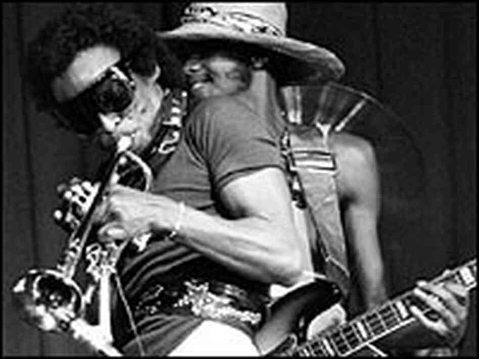 Miles Davis performs in 1973 with saxophonist Dave Liebman and bassist Michael Henderson.