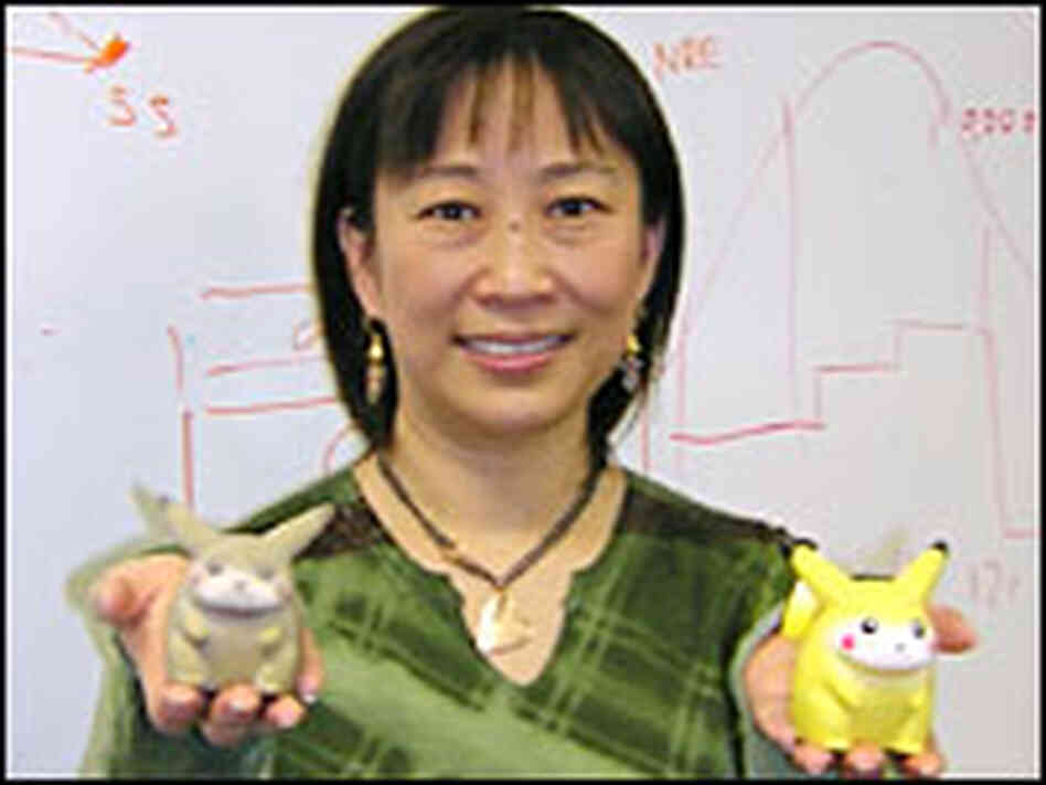 Ping Fu holds two Pikachu dolls. Ping Fu holds two Pikachu dolls.