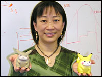 Ping Fu holds two Pikachu dolls. The one on the left was the first object ever created using Geomagic's technology, based on a scan of the doll on the right.