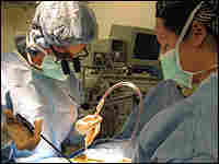 Dr. Monica Wehby performs a surgery that severs tissues at the base of the spine. Dr. Monica Wehby performs a surgery that severs tissues at the base of the spine.
