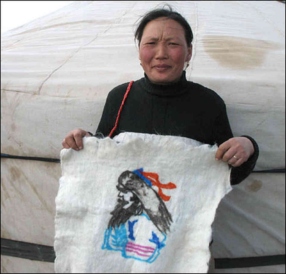 Nomadic herder Altanchimeg now creates wool and leather souvenirs to sell to tourists. Nomadic herder Altanchimeg now creates wool and leather souvenirs to sell to tourists.