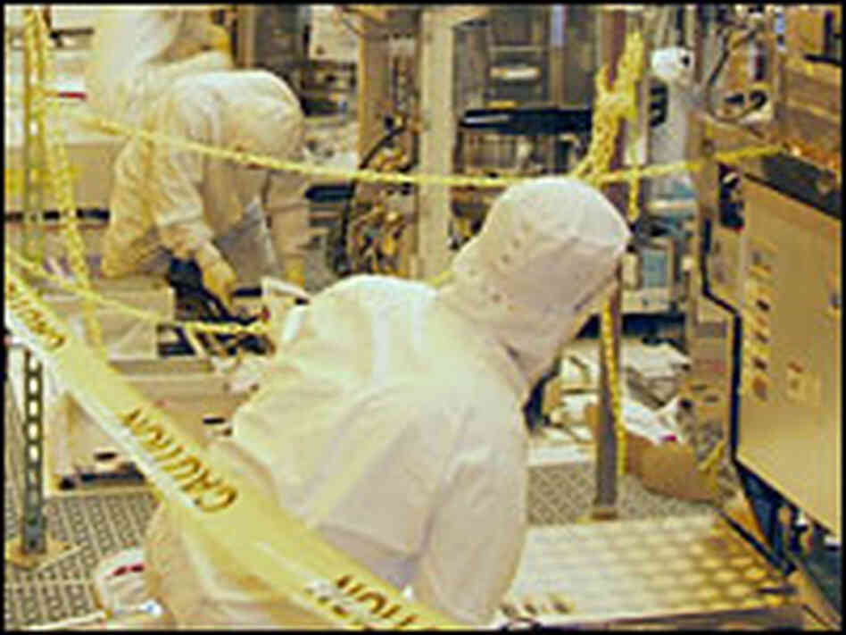 Engineers at Intel's "Fab" make computer chips.