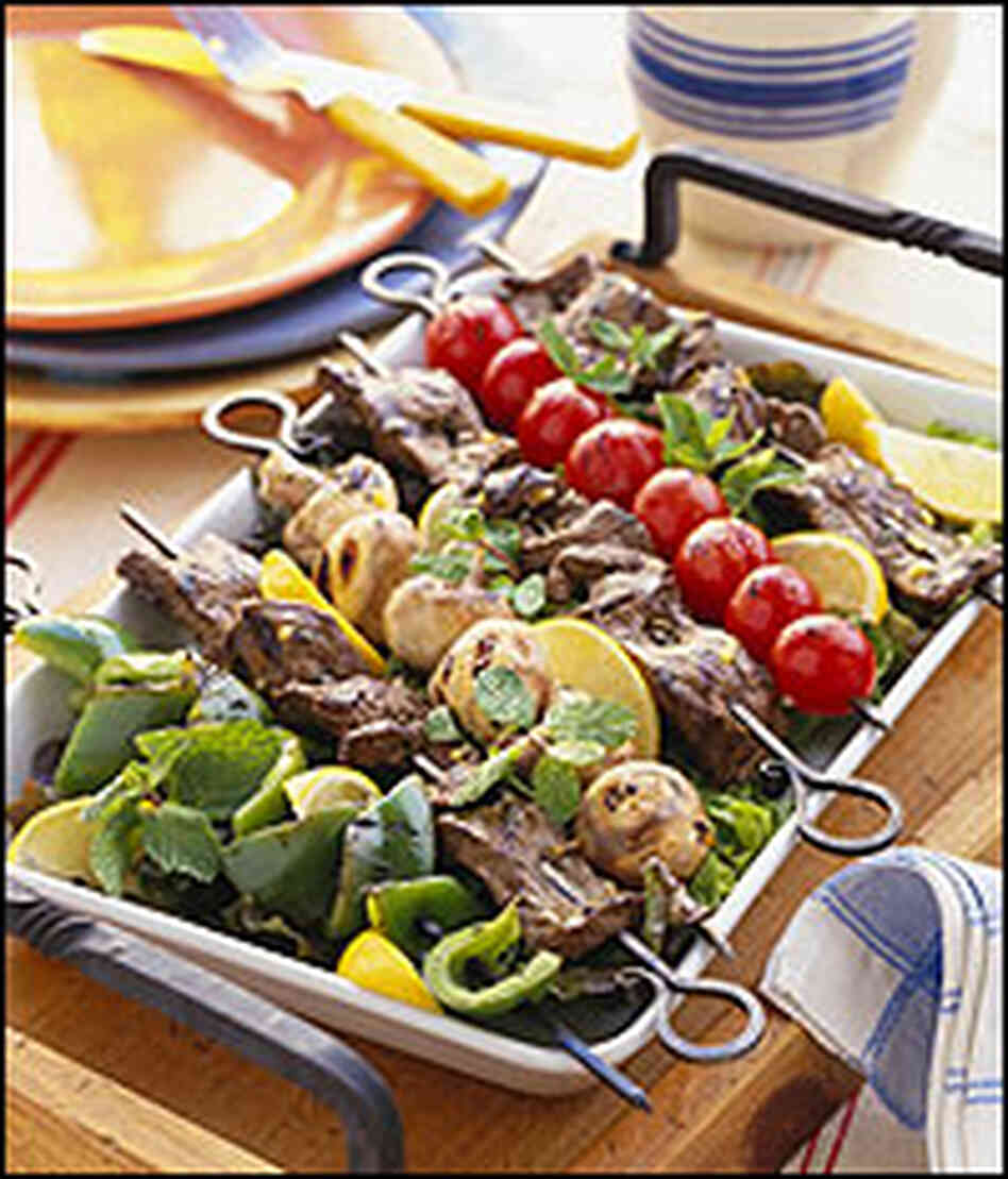 A summer grill of vegetables and kabobs. A summer grill of vegetables and kabobs.