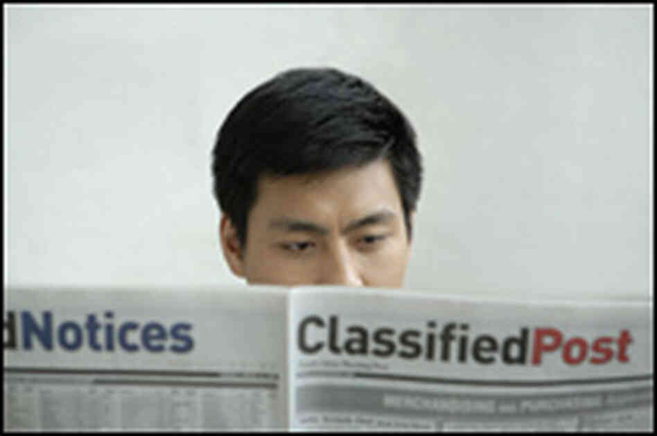 Man reading classified ads Man reading classified ads