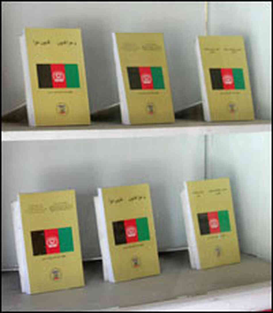Copies of Afghanistan's legal code fill a display case in the lobby of the Supreme Court building.