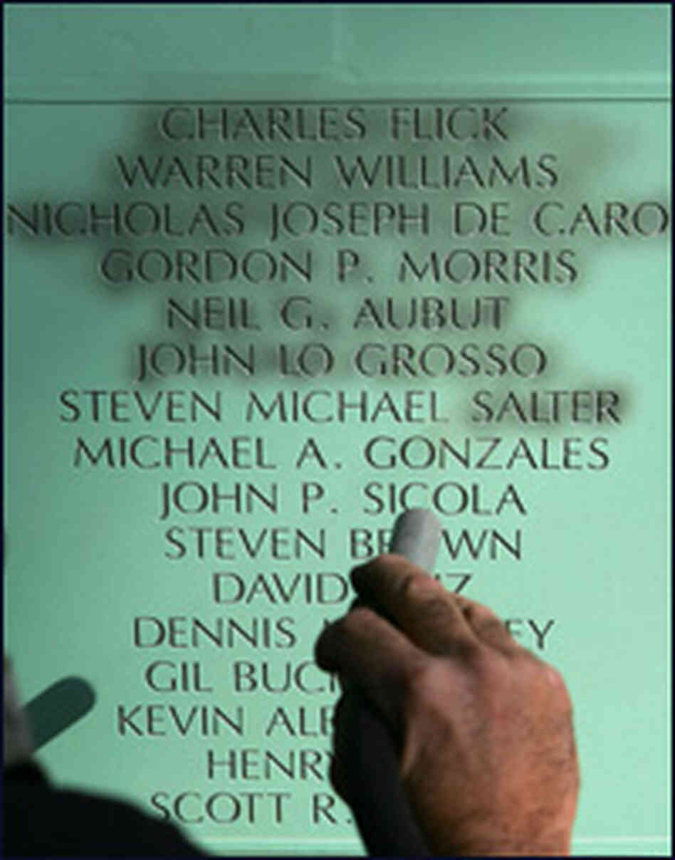 The names of new AIDS victims are being added to a memorial in Los Angeles in preparation for World The names of new AIDS victims are being added to a memorial in Los Angeles in preparation for World