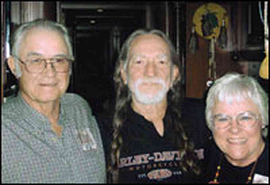 Farmer-ranchers Gordon and Helen Waller meet with Willie Nelson (center), co-creator of Farm Aid.