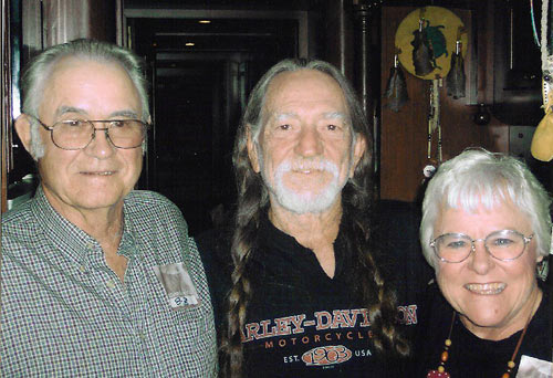 Farmer-ranchers Gordon and Helen Waller meet with Willie Nelson (center), co-creator of Farm Aid.